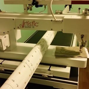 Tin Lizzy quilt machine with quilt rack.